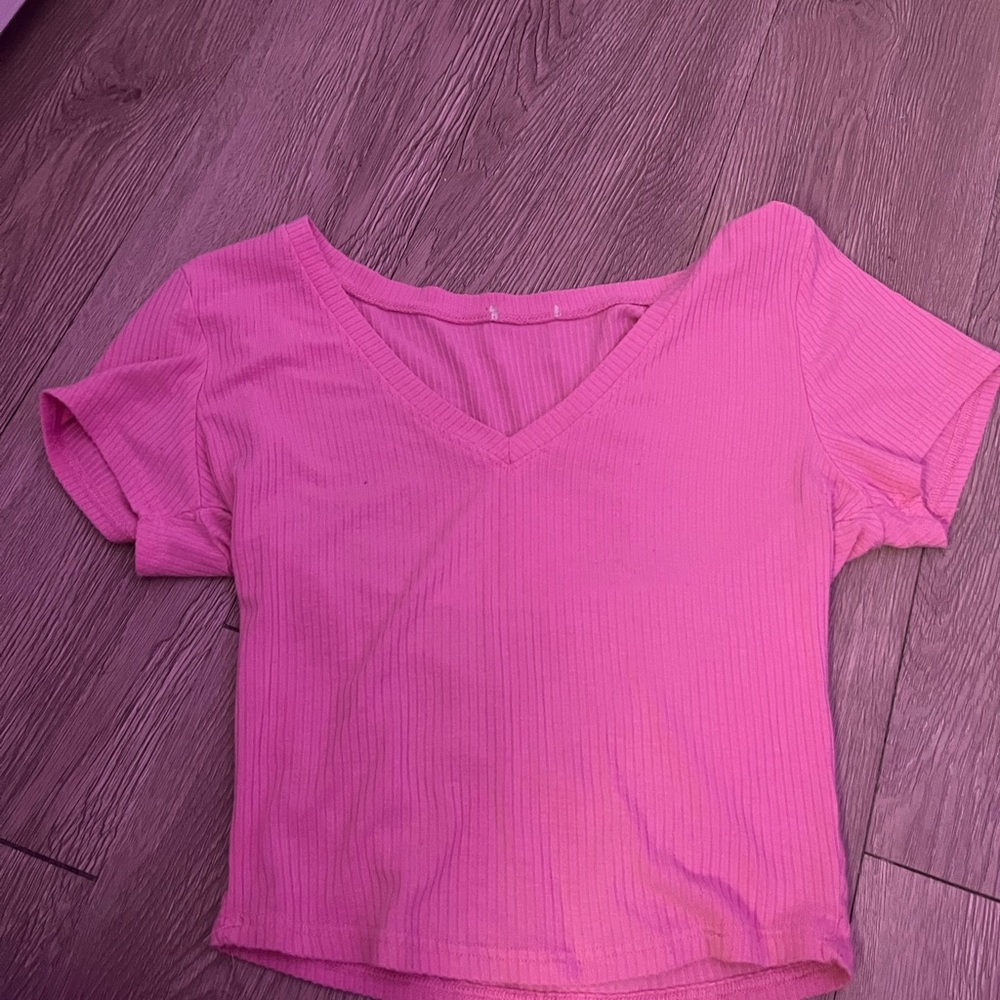 Pink low cut crop top in a medium